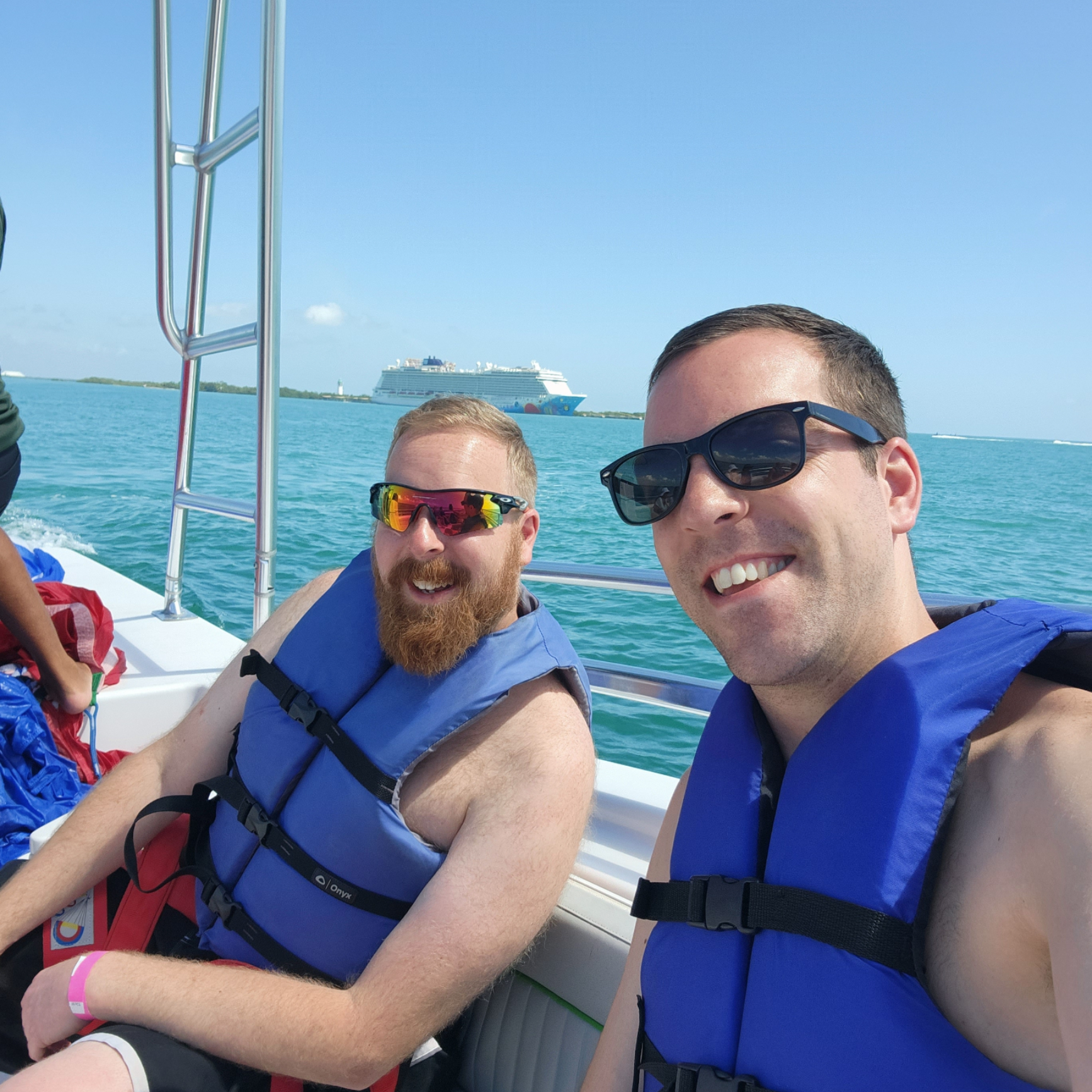 Kevin, alongside his brother Craig, set to soar over Belize's stunning waters during our family cruise. Parasailing adventure awaits! 🌊🪂🚢