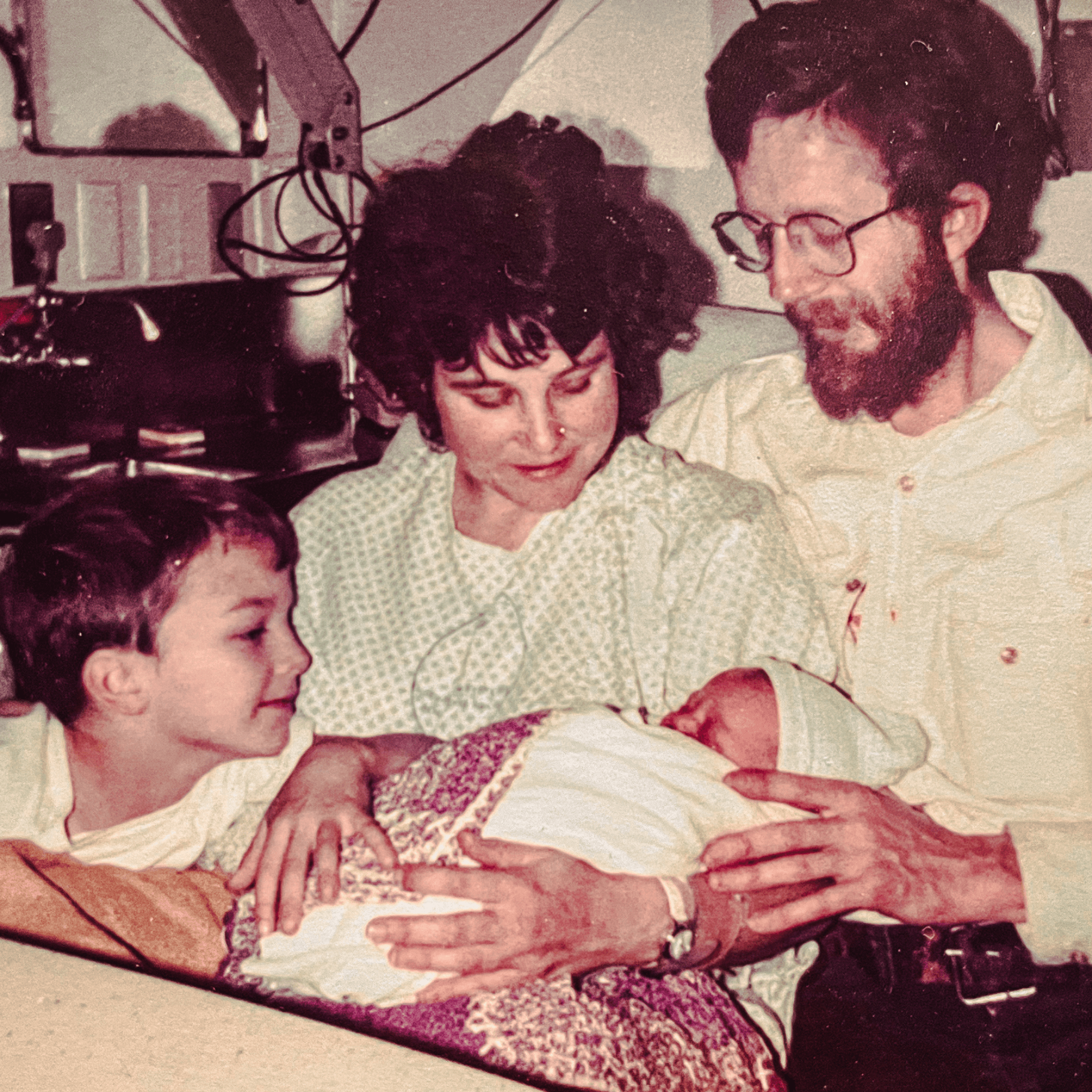 Baby me! With my mom, dad, and brother Nick.