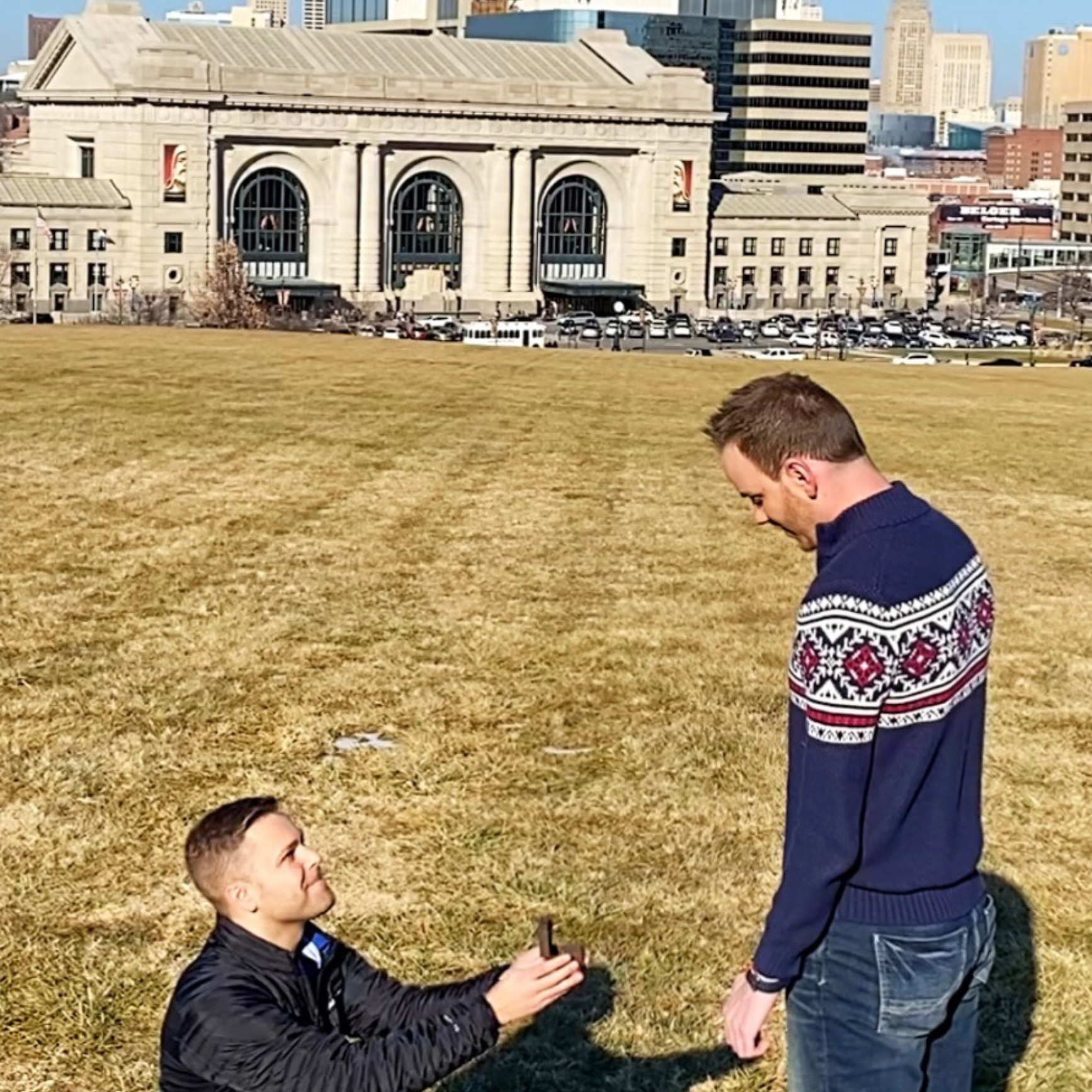 Evan proposing to Wesley back in Kansas City in front of Union Station.